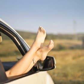 Photo by Andrea Piacquadio: https://www.pexels.com/photo/crop-carefree-woman-with-legs-sticking-out-of-car-window-3756167/