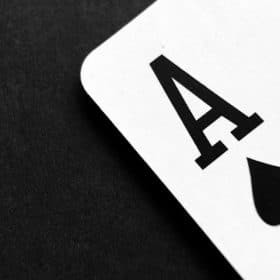 Photo by Pixabay: https://www.pexels.com/photo/ace-of-spade-playing-card-on-grey-surface-262333/